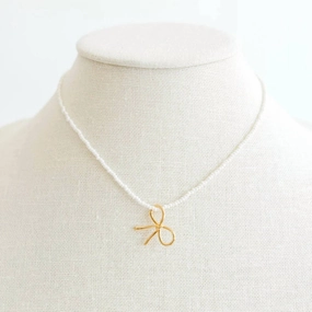 Pearl Charm Bow Necklace In Gold